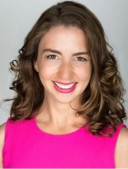 Headshot of Rachael Heger wearing a pink dress